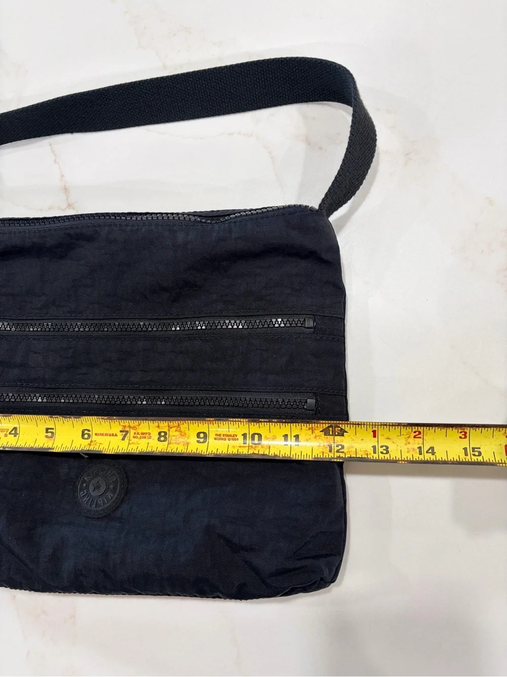 Kipling Black Compact Crossbody Bag with adjustable strap and 5 zipper pockets